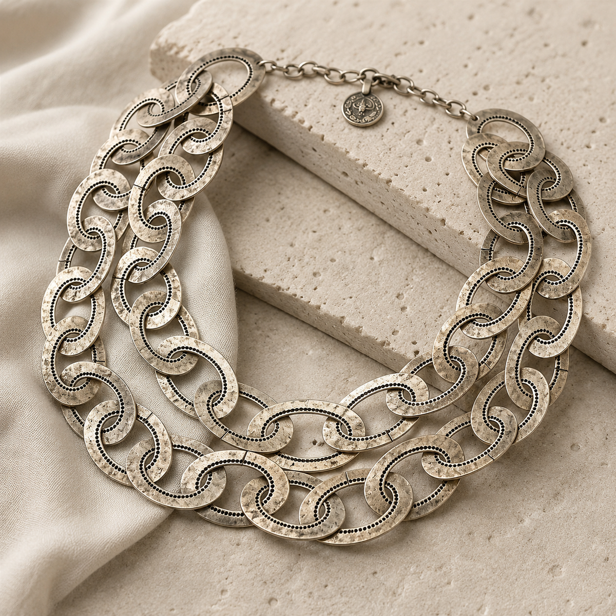 Angle view of the oversized silver-tone chain link necklace.