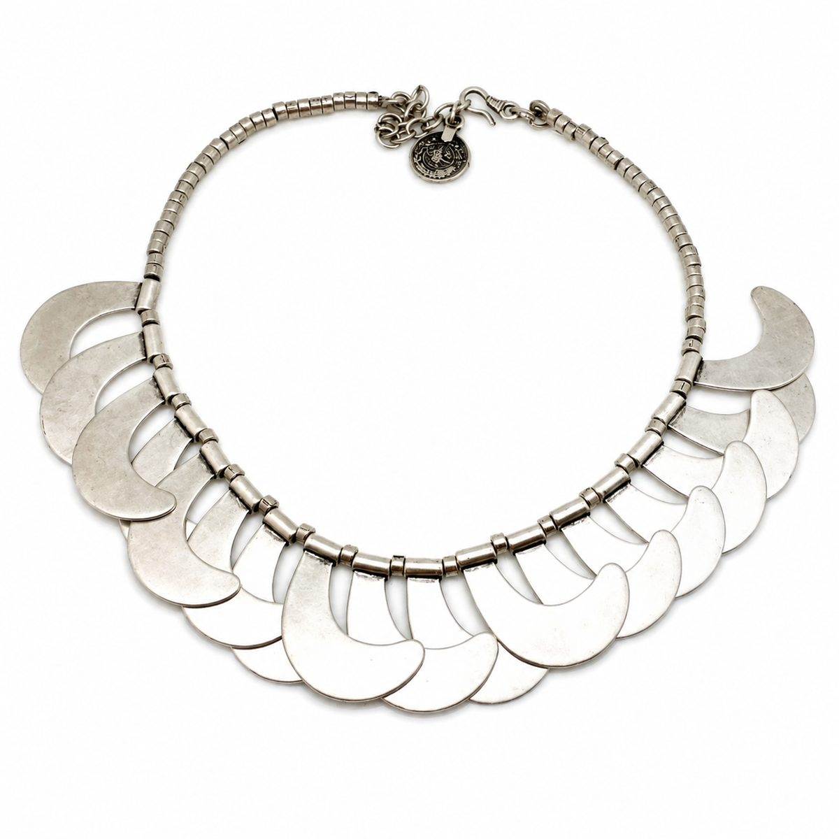 Silver-tone crescent scale collar necklace with layered disc details.