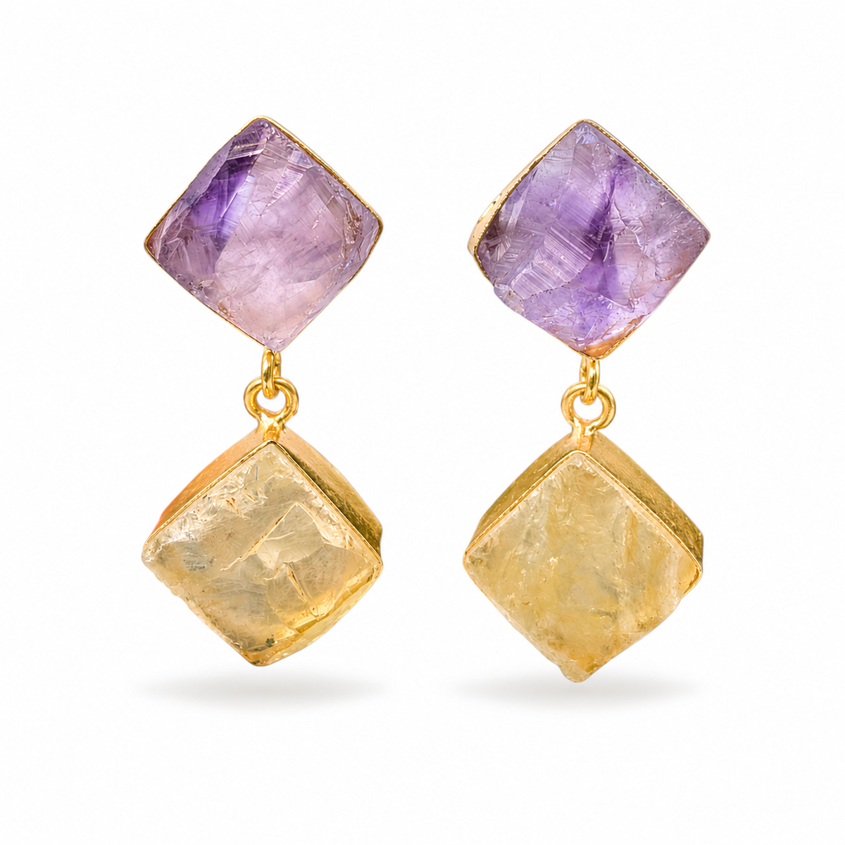 Pair of gold-plated drop earrings with faceted purple and golden stones.