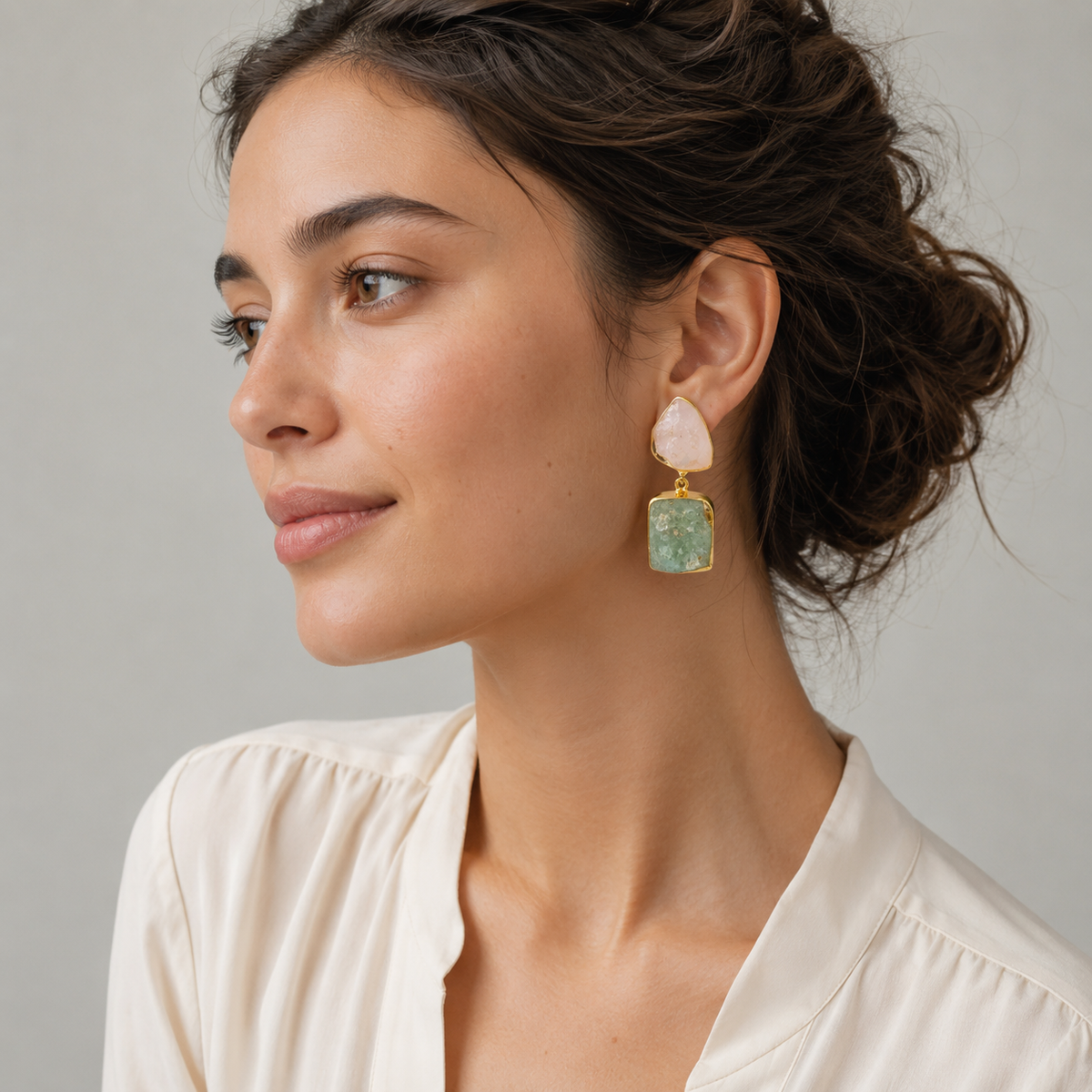 Natural stone drop earrings with pink and green stones and a gold plated frame.