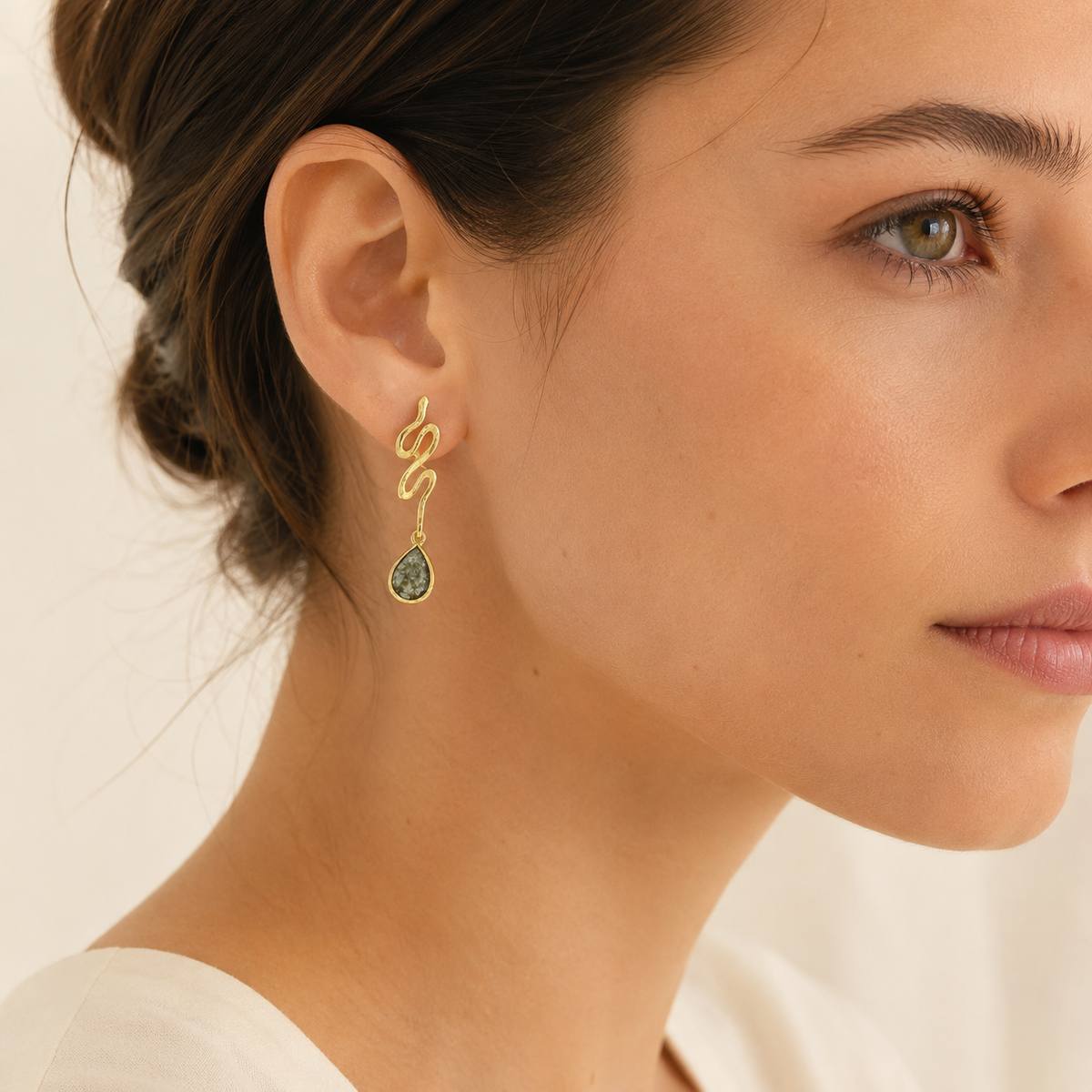 Gold-plated snake drop earrings shown from a different angle.