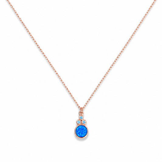 Blue opal pendant necklace with a rose gold-tone chain on a white background.