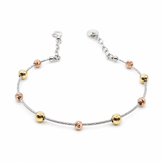 Dorika bracelet with a slim silver-tone cable chain and mixed metallic beads.