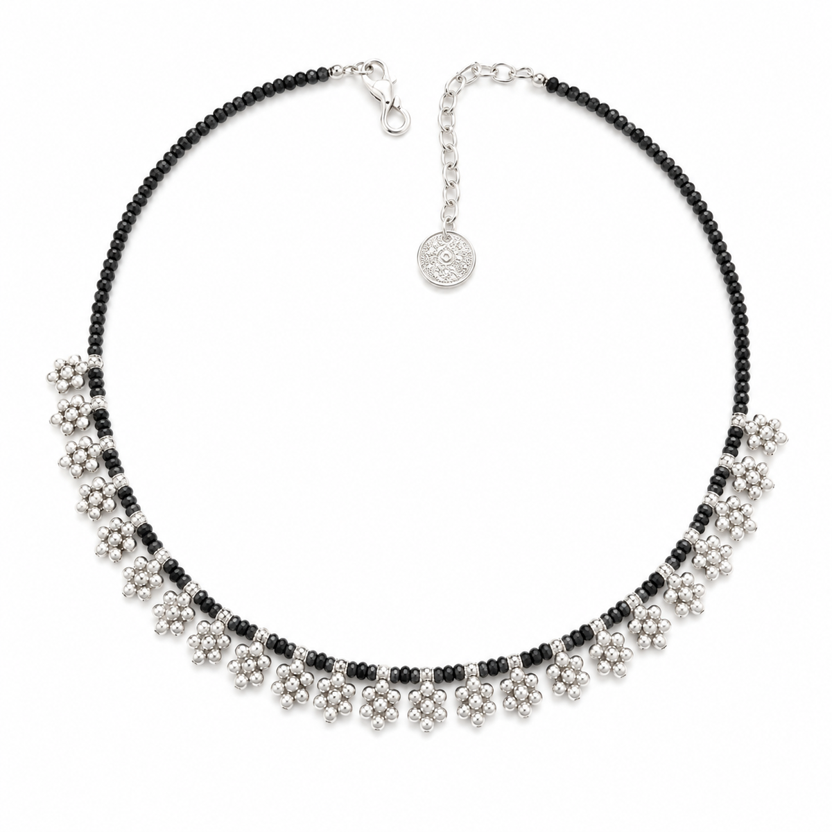 Black bead necklace with floral fringe accents and silver-tone details.