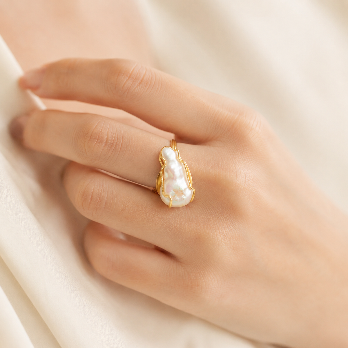 Baroque pearl statement ring with a gold-plated setting shown from the front.