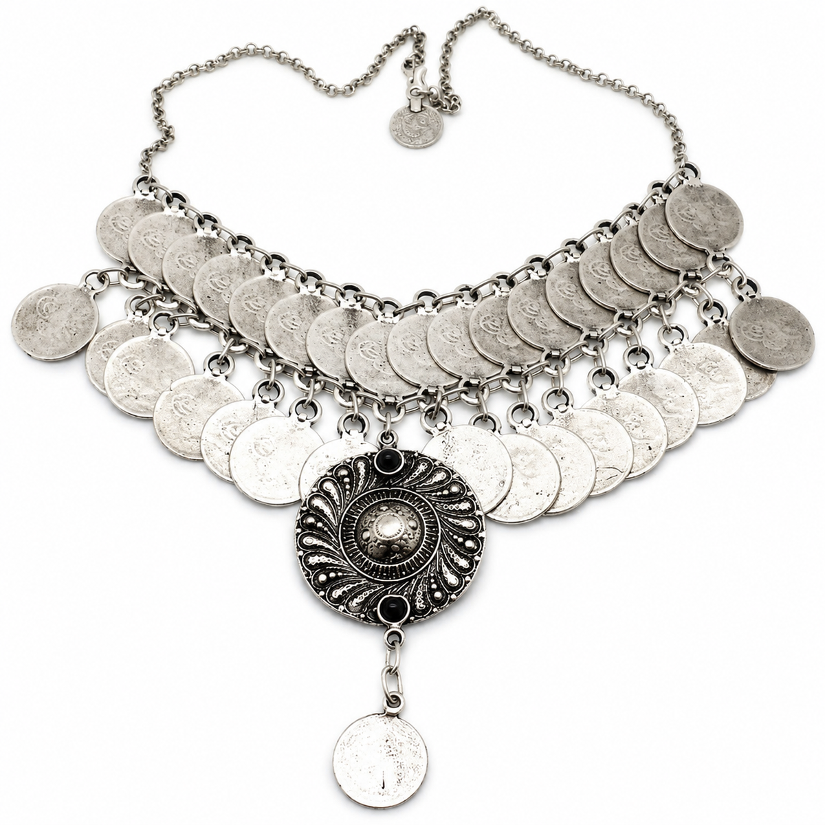 Layered silver-tone coin bib necklace with a dark center pendant and drop detail.