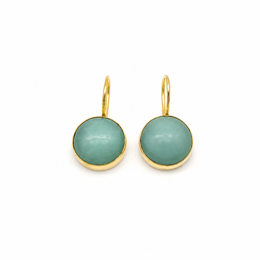 Pair of clear quartz drop earrings with a polished gold-plated setting.