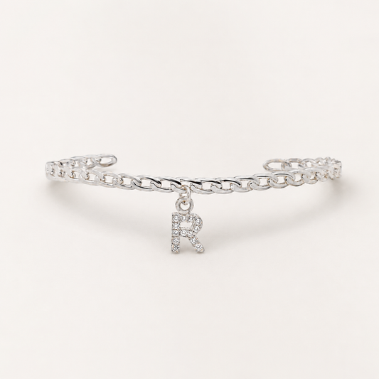 Silver-tone cuff bracelet with a CZ initial charm.