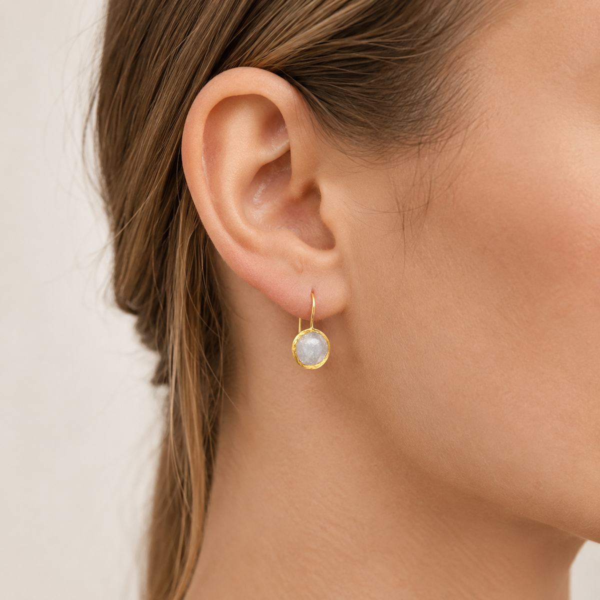 Pair of round clear CZ gold-plated drop earrings with a drop silhouette.