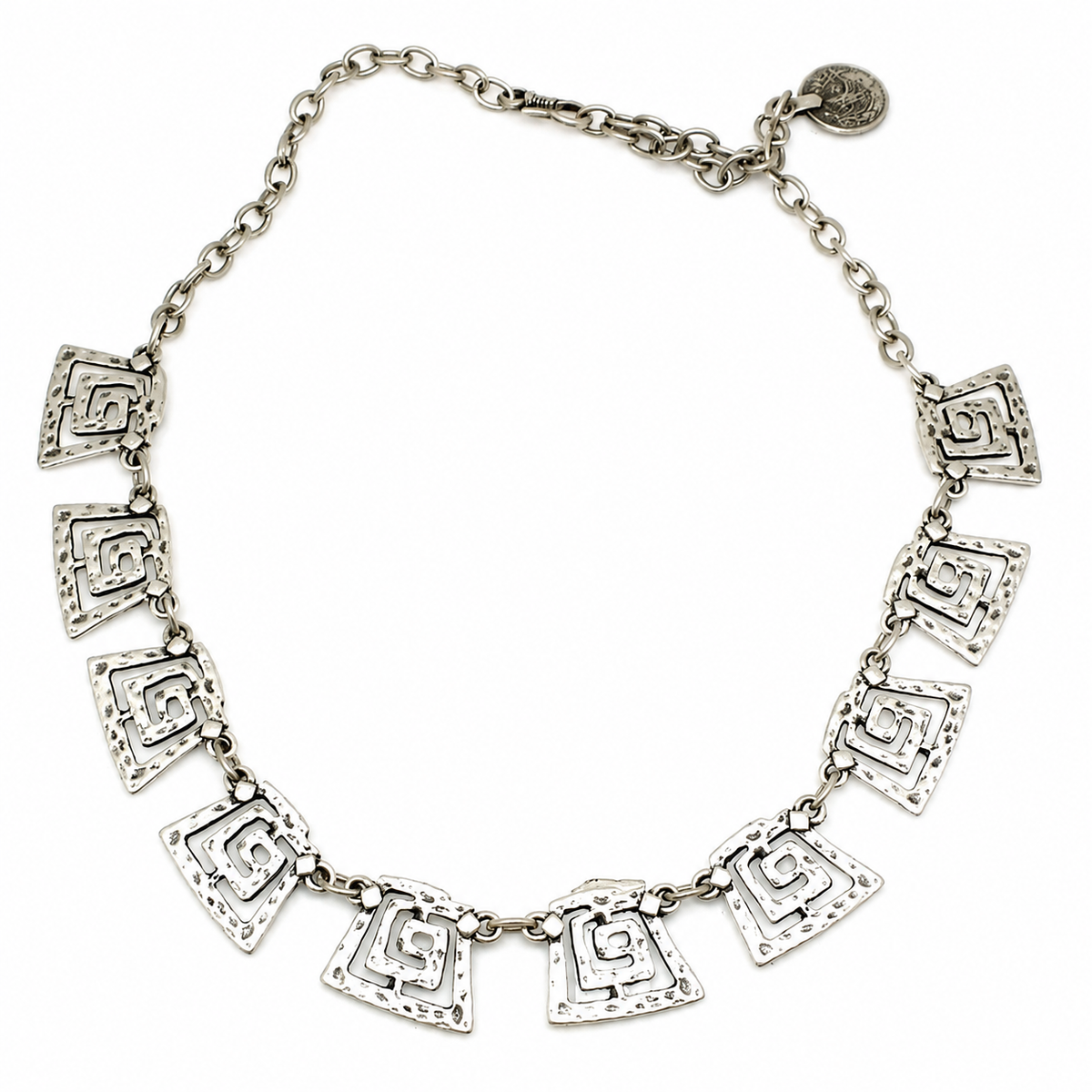 Silver-tone necklace with spiral square links arranged in a bold statement silhouette.