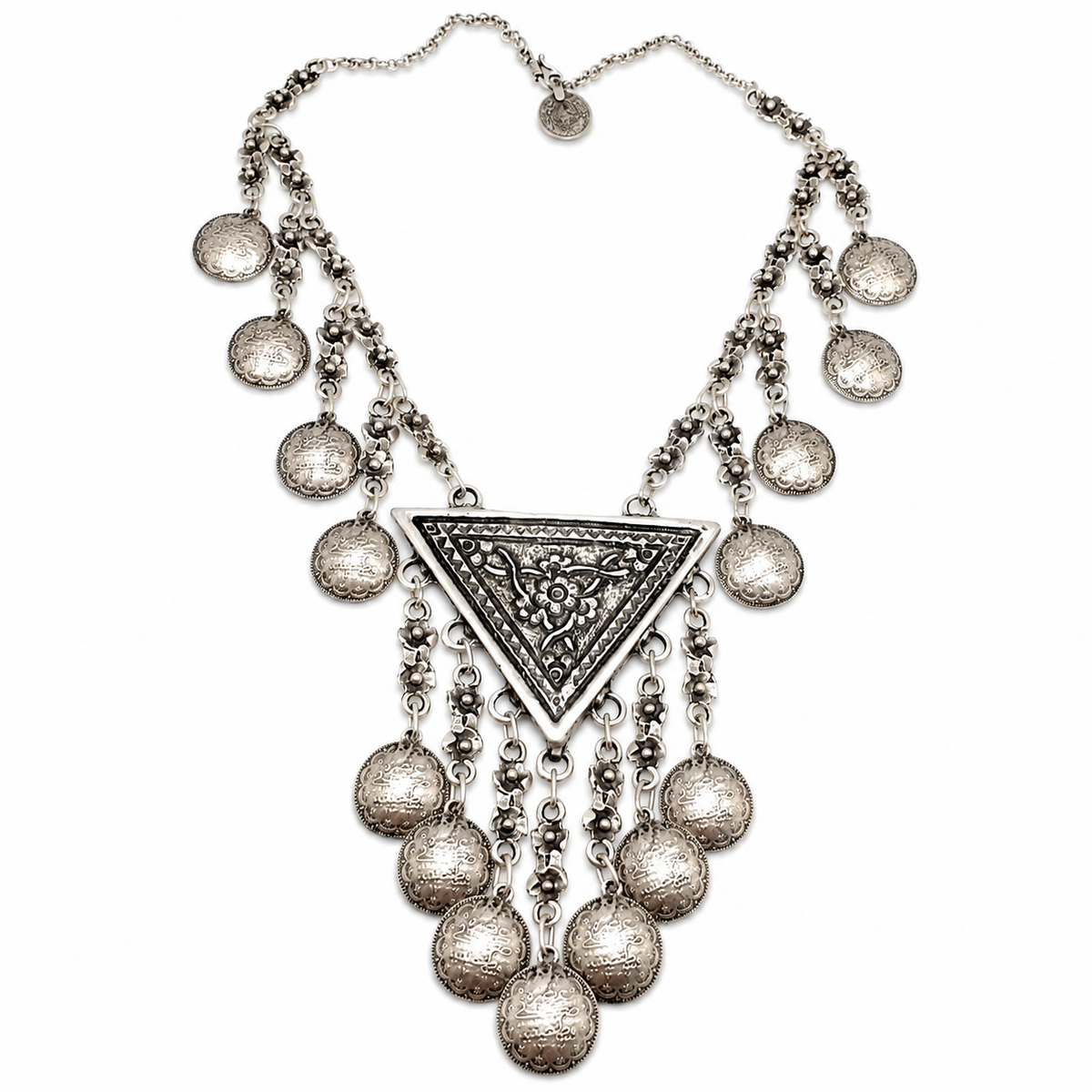 Silver-tone necklace with a crescent centerpiece and teardrop coin fringe.