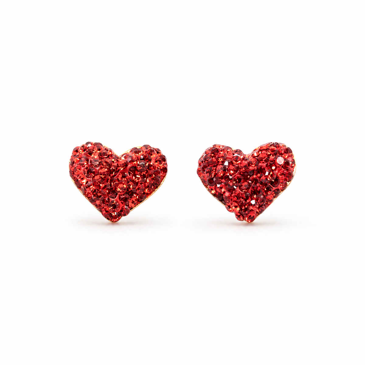 Pair of red crystal heart stud earrings with a gold-plated look on a white background.