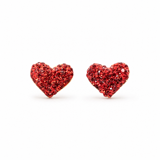 Pair of red crystal heart stud earrings with a gold-plated look on a white background.
