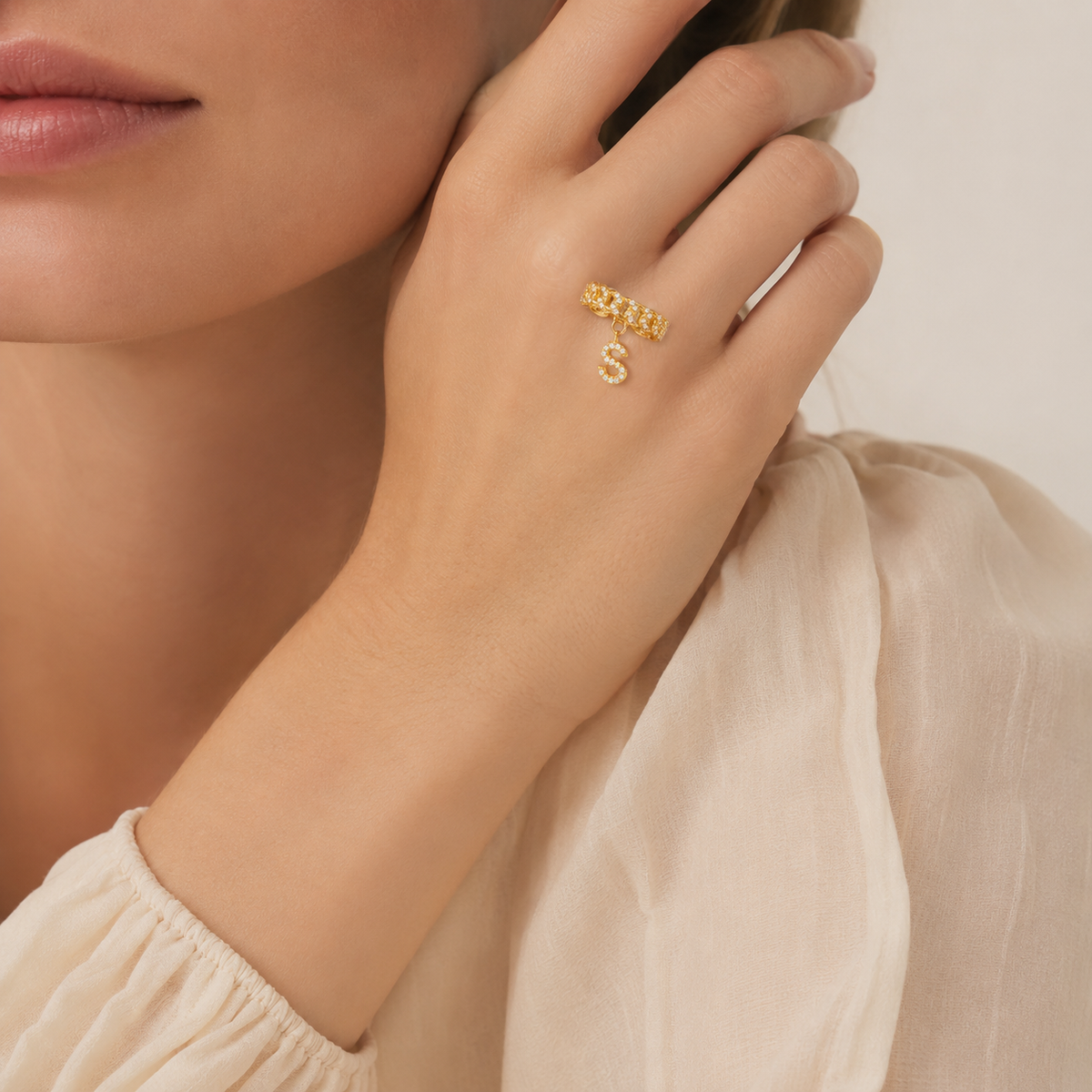 Personalized gold-tone cuff ring with a CZ initial charm.