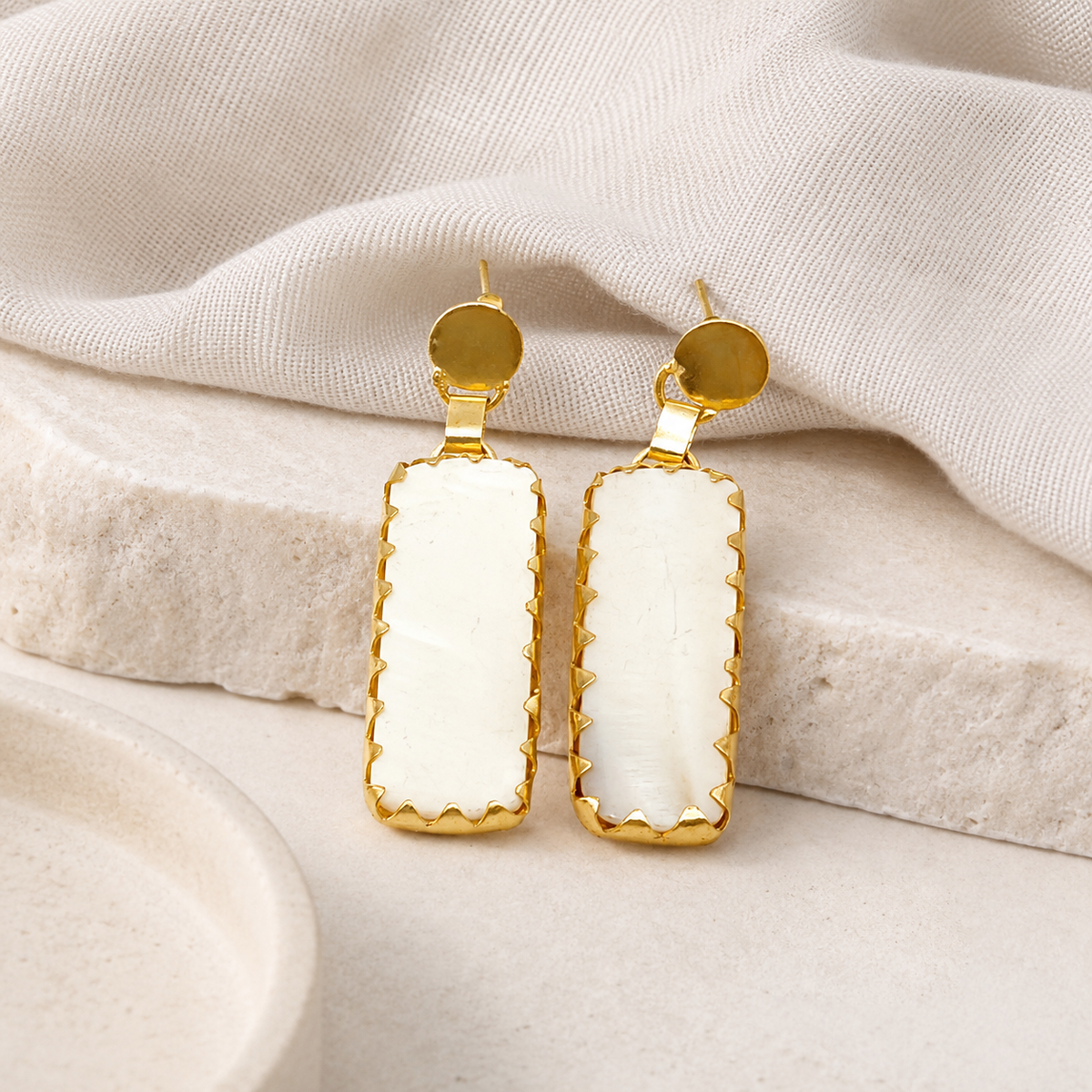 Pair of gold-plated drop earrings with long rectangular drops and a polished round stud top.