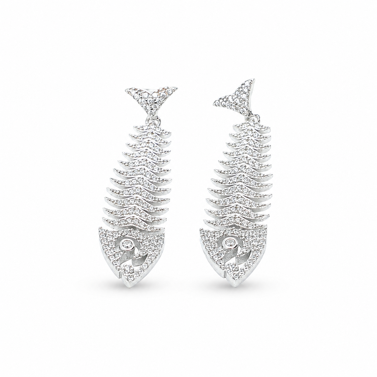 Silver fish bone earrings with sparkling CZ detail and a bold drop silhouette.