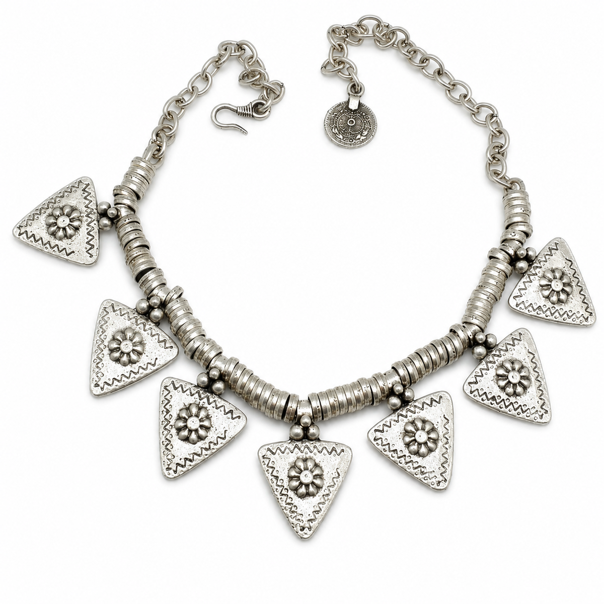 Silver-tone necklace with triangle flower charms and textured links on a white background.