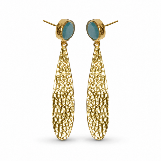 Hammered gold-plated drop earrings with textured long pendants and soft blue oval accents.