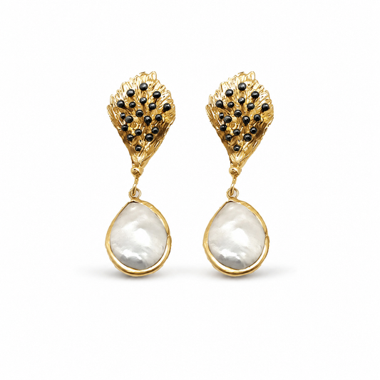 Pair of gold-tone drop earrings with textured leaf tops, black bead accents, and pearl-like drops.