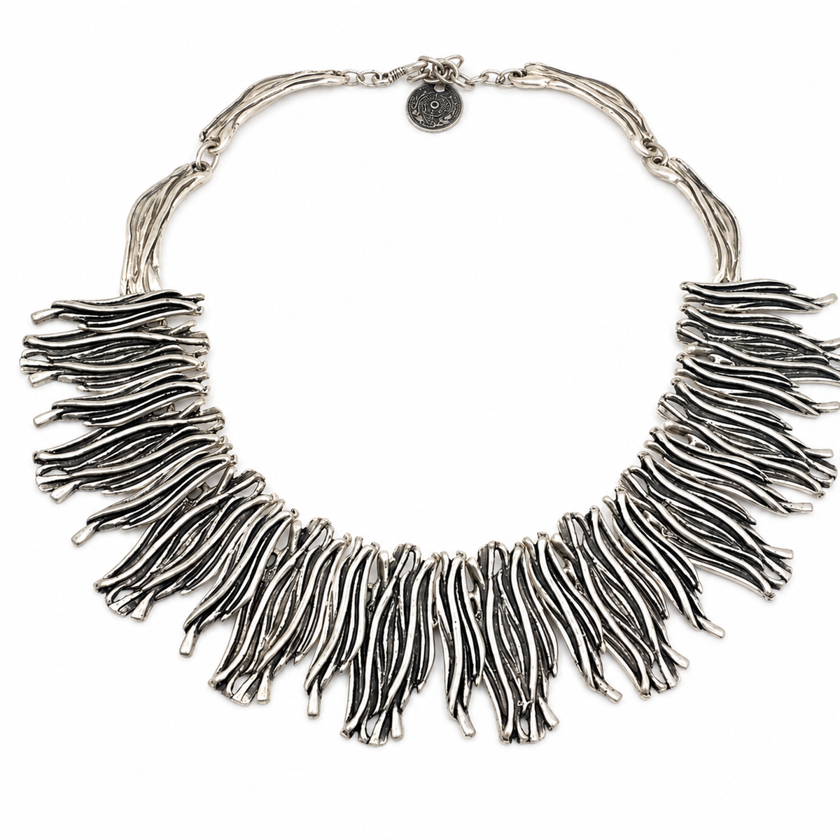 Silver-tone organic fringe collar necklace with layered sculptural strands.