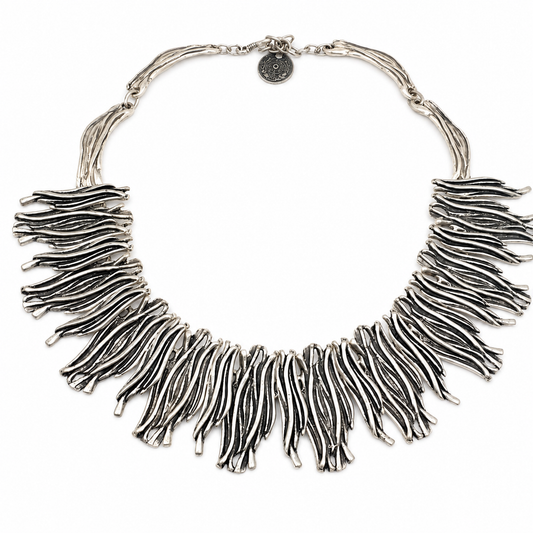 Silver-tone organic fringe collar necklace with layered sculptural strands.