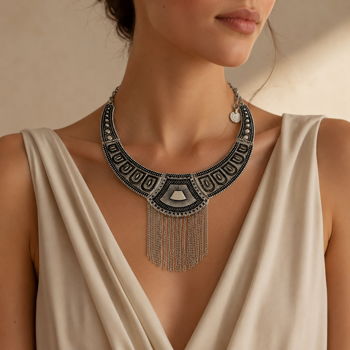 Statement necklace with black geometric panels and a silver-tone chain fringe.