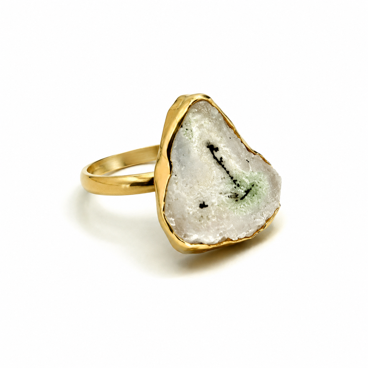 Angled view of a solar quartz slice ring with a gold-plated frame.