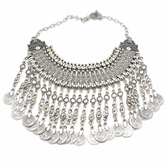 Silver-tone boho statement necklace with layered coin fringe and detailed cutout accents.
