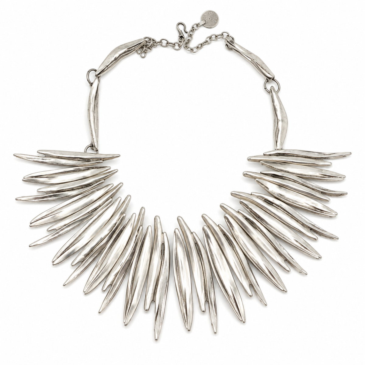 Silver-tone spiky collar necklace with a sculptural fan shape.