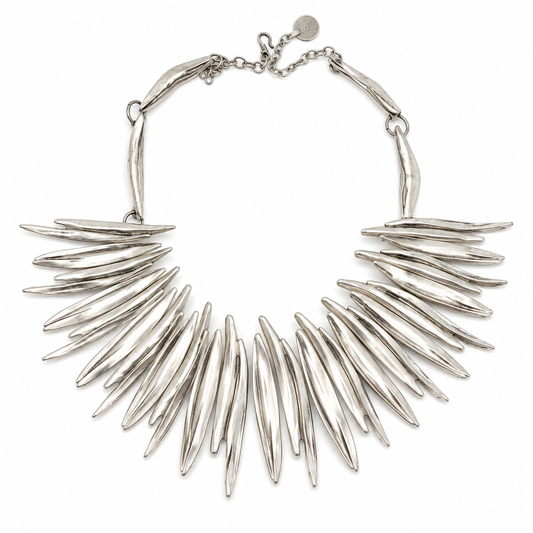 Silver-tone spiky collar necklace with a sculptural fan shape.