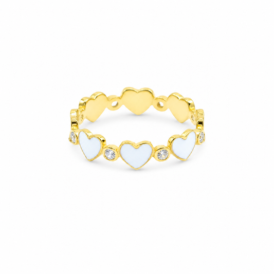 Gold-plated ring with white heart accents and small clear stones.