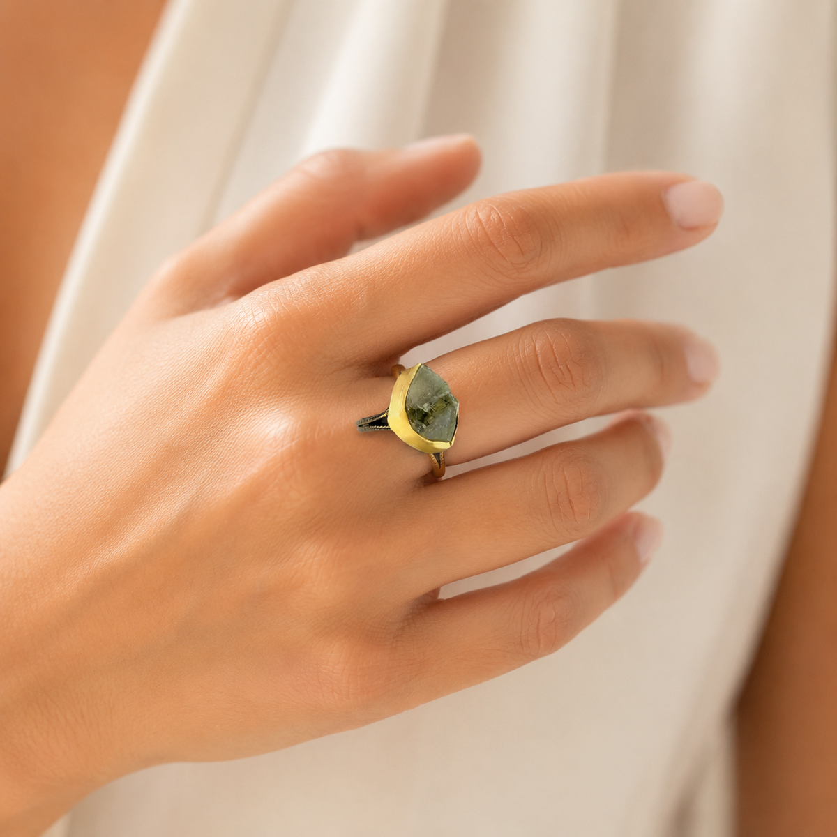 Raw green amethyst statement ring shown from the side with a gold-plated setting.