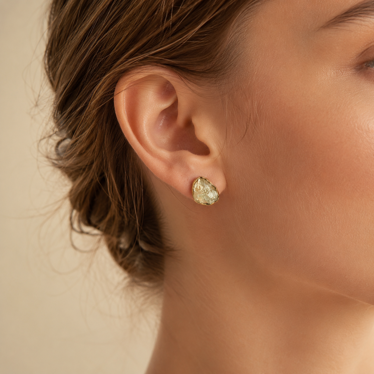 Raw quartz stud earrings shown in a gold-plated finish.