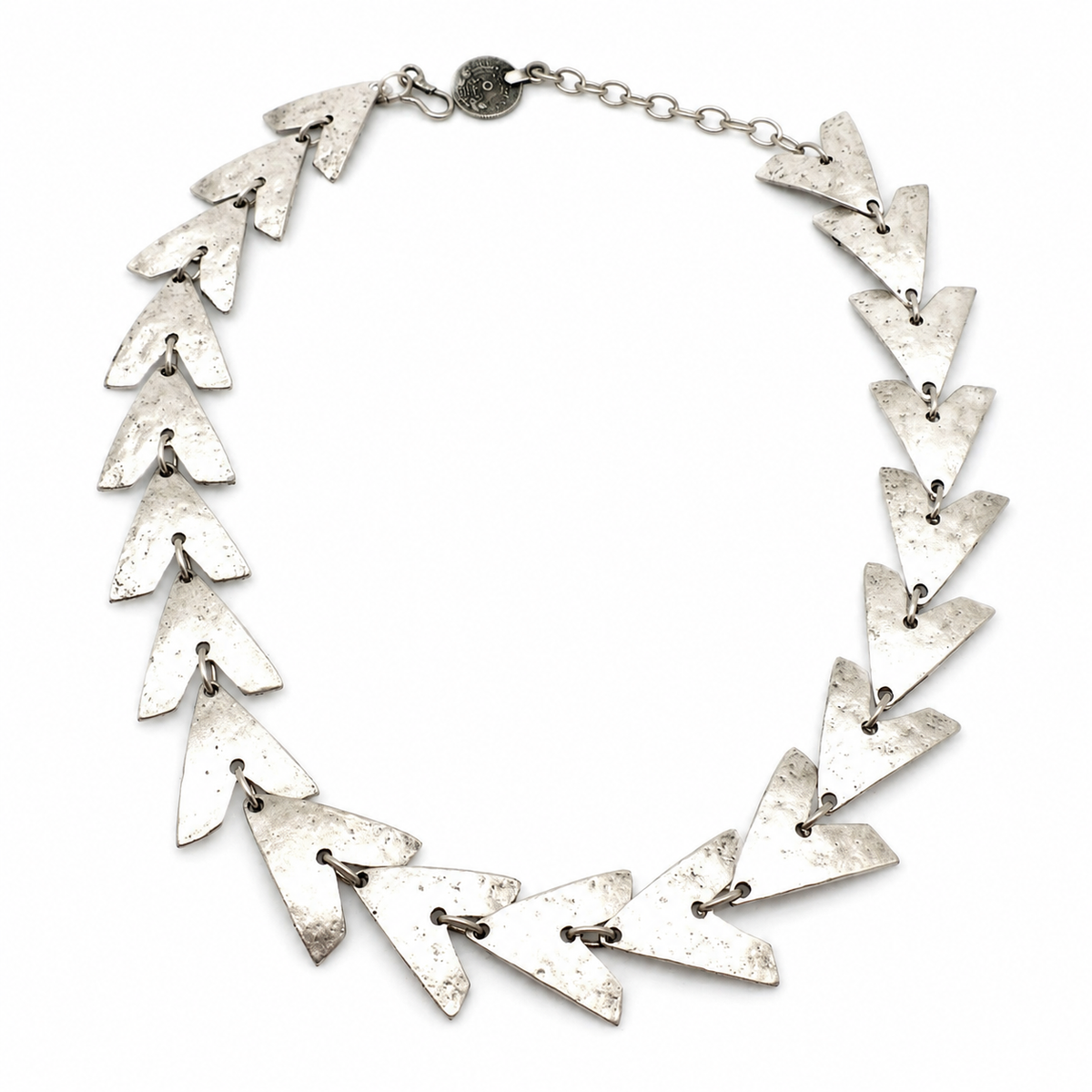 Triangle link statement necklace with a textured silver-tone finish.