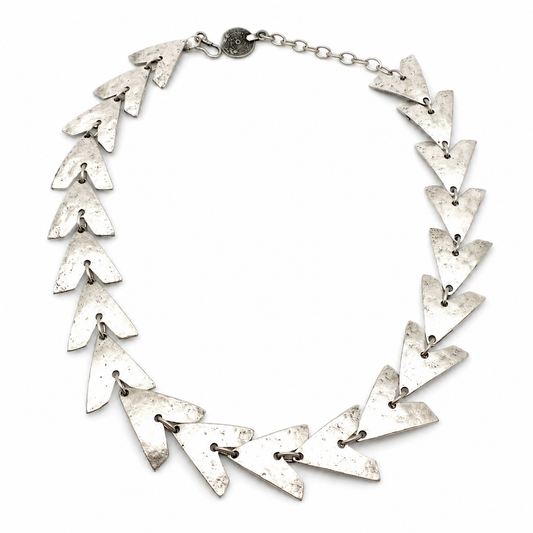 Triangle link statement necklace with a textured silver-tone finish.