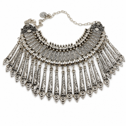 Silver-tone boho collar necklace with layered paddle fringe and intricate textured details.