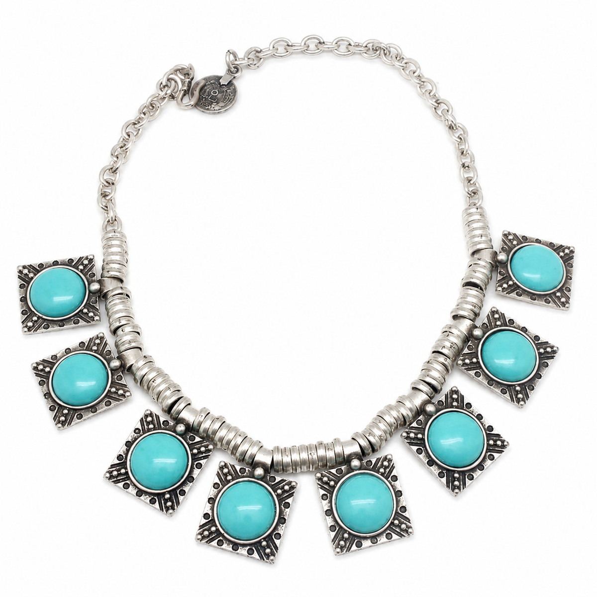 Turquoise star charm necklace with silver-tone details and a bold statement silhouette.