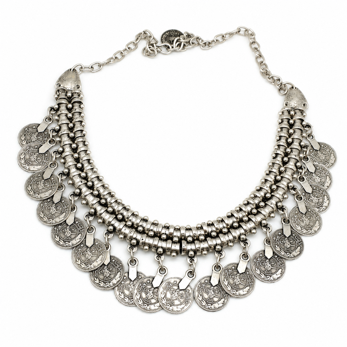 Silver-tone collar necklace with layered coin fringe and textured disc details.