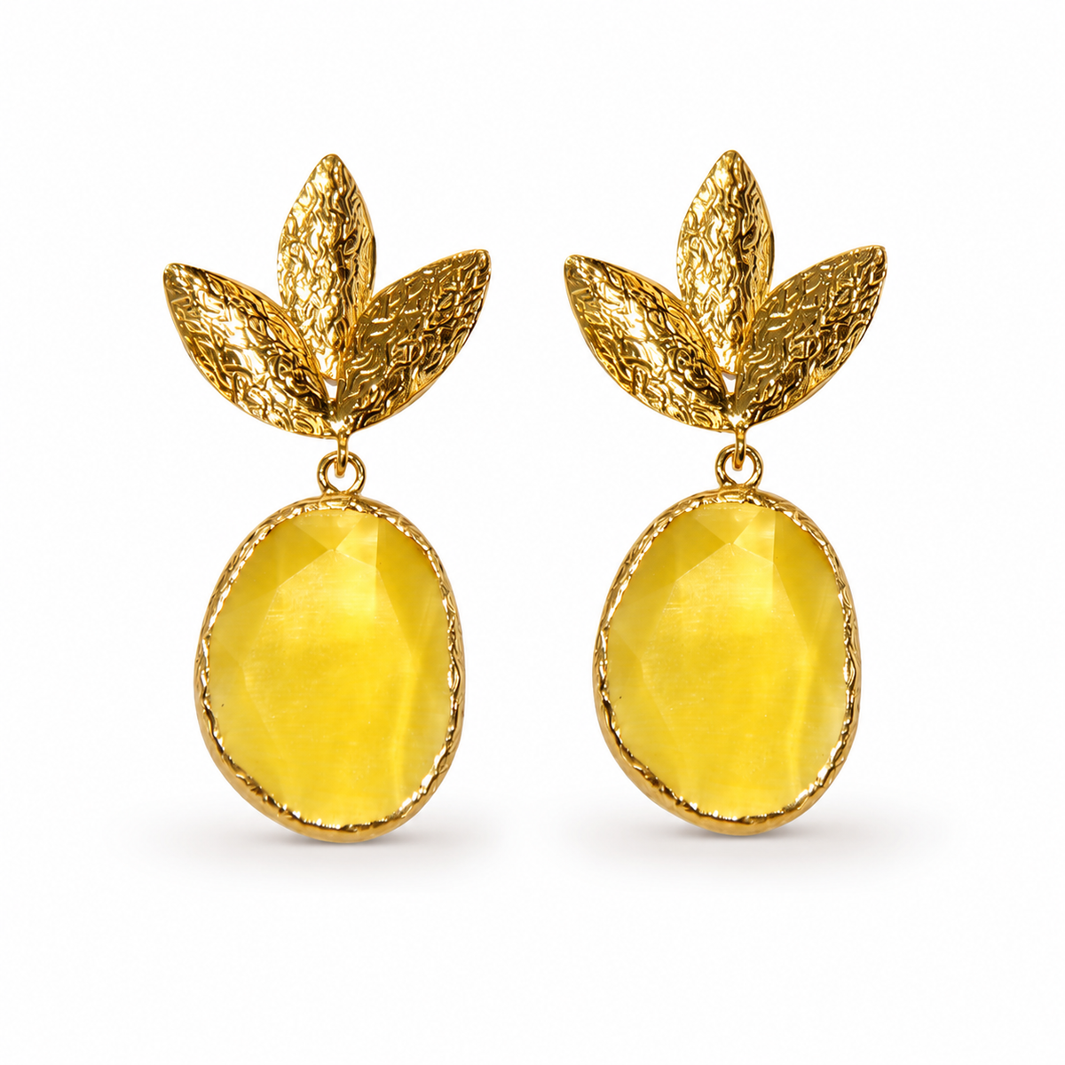 Pair of gold plated drop earrings with textured leaf shapes and mustard yellow oval drops.