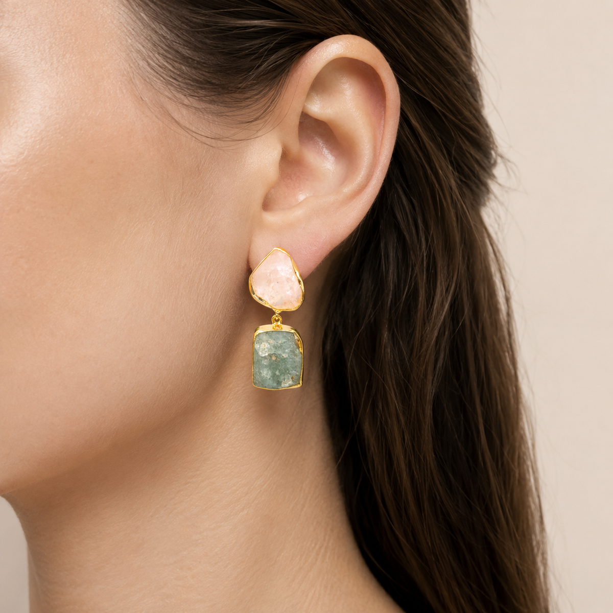 Pair of gold plated drop earrings with pale pink and green natural stone accents.