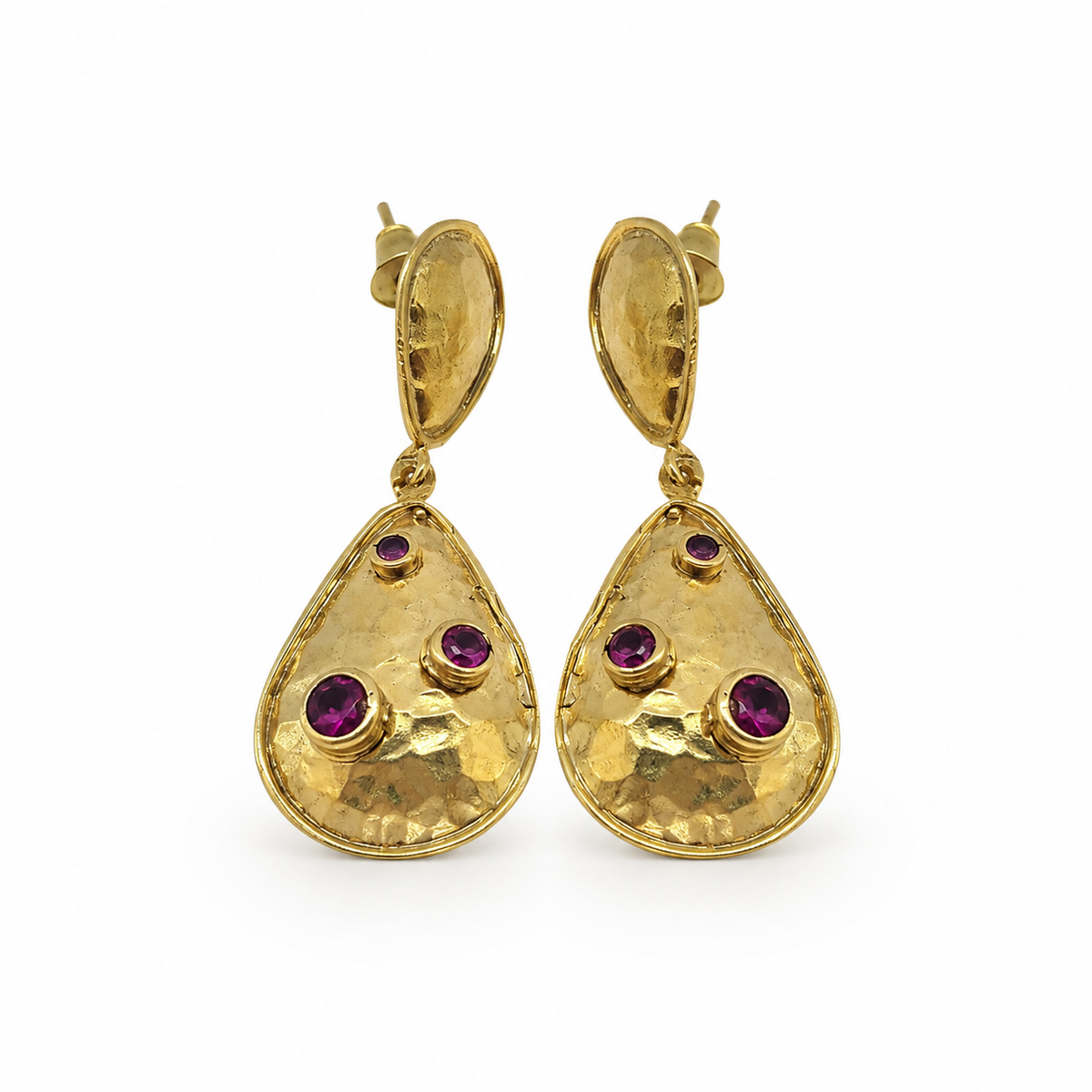 Gold-plated teardrop earrings with clear crystal accents on a white background.
