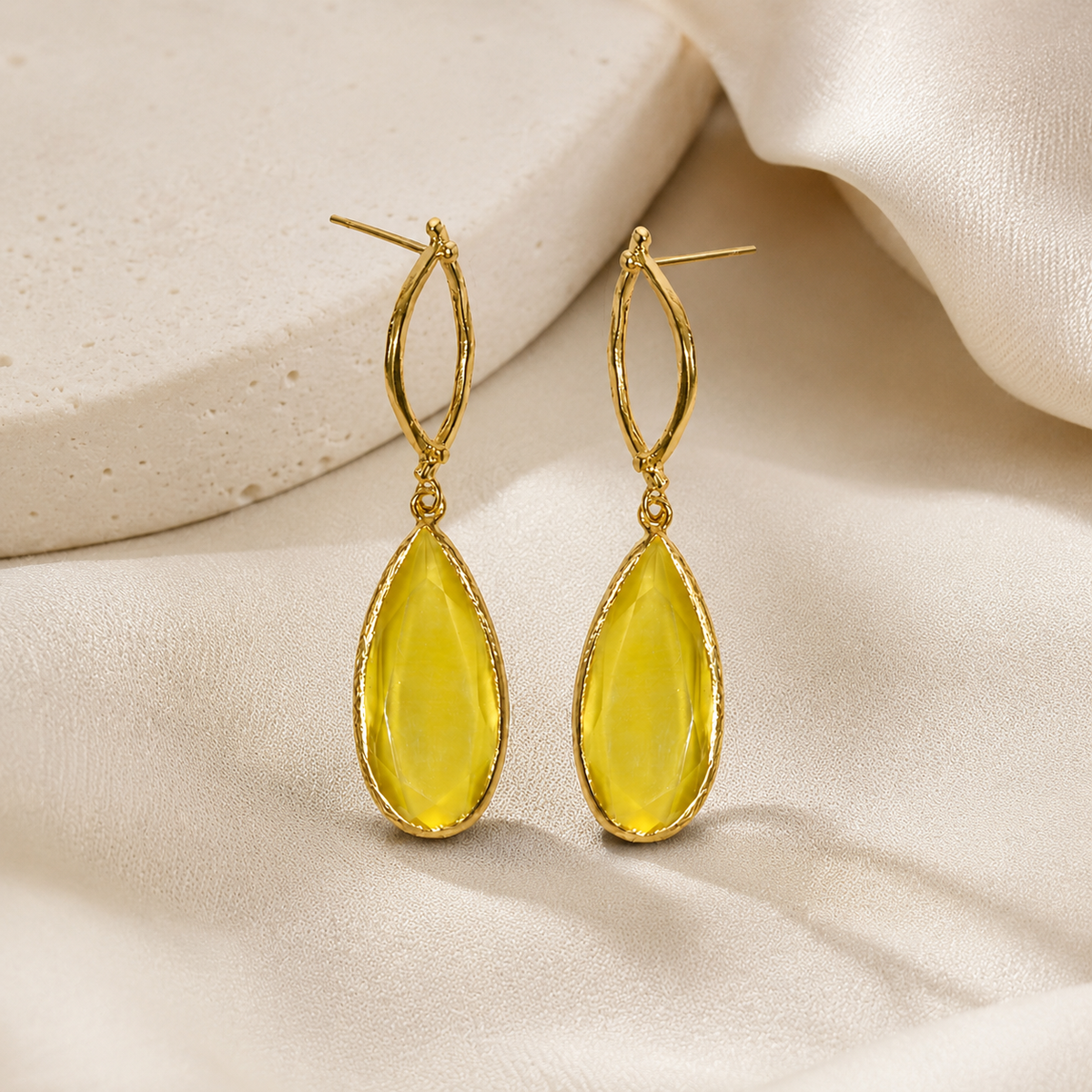 Gold plated oval drop earrings with faceted mustard stones.