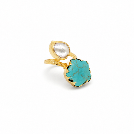 Gold-plated ring with a turquoise stone and pearl-like accent.