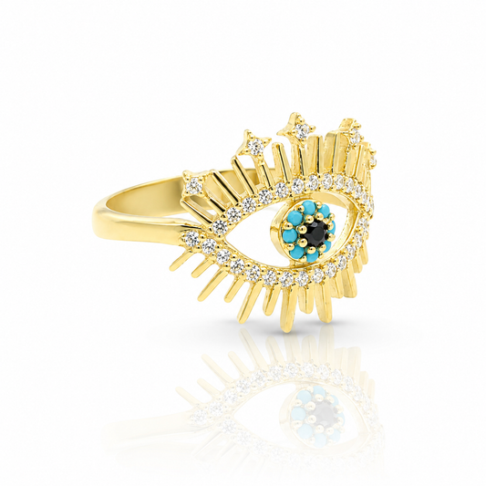 Gold-tone evil eye ring with sparkling accents and a vivid center detail.