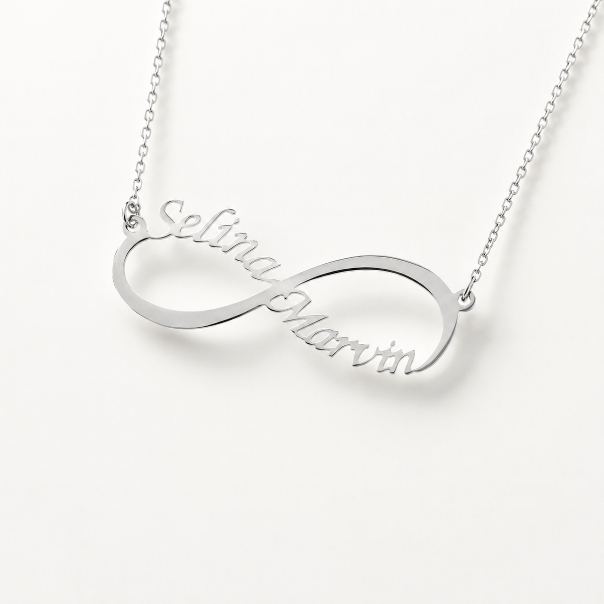 Silver-tone infinity name necklace with personalized engraved lettering.