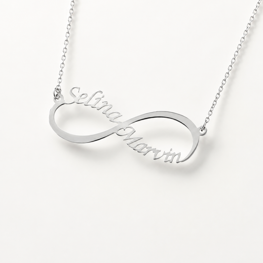 Silver-tone infinity name necklace with personalized engraved lettering.