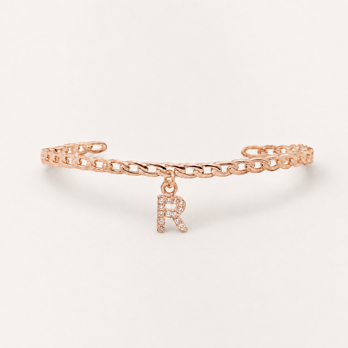 Silver-tone initial cuff bracelet shown from a clean front angle.