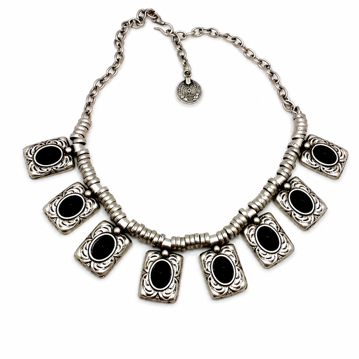 Silver-tone necklace with black oval center charms in a rectangular design.