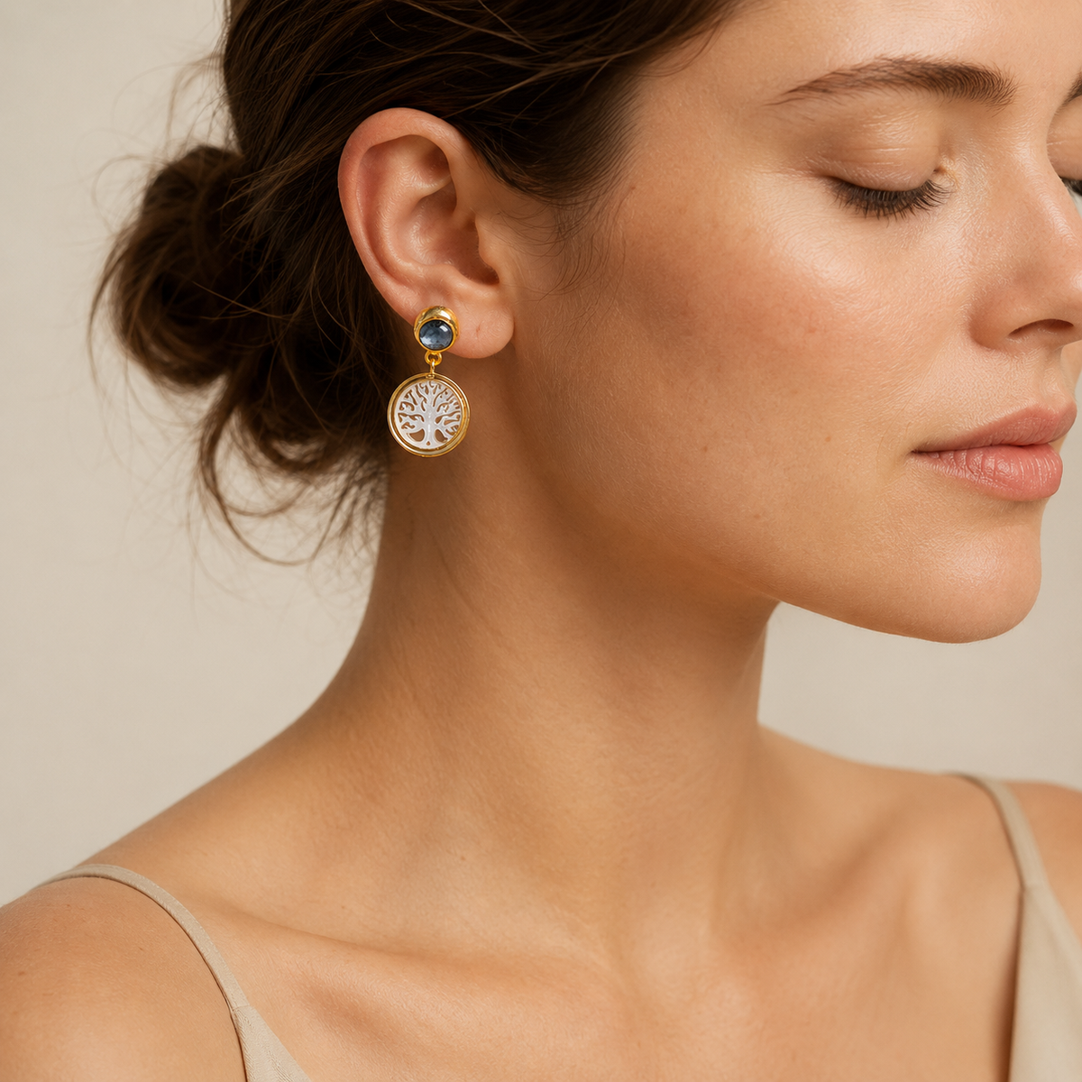 Pair of Tree of Life drop earrings with black onyx and gold plating.