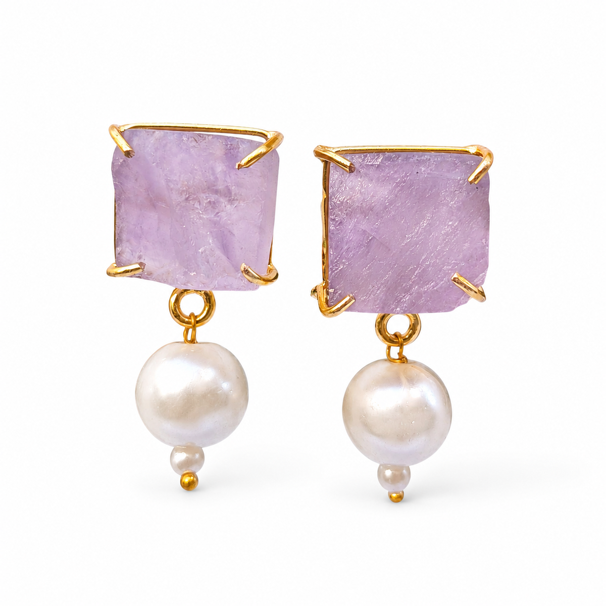 Pair of drop earrings with rough lavender stones, gold-plated accents, and pearl drops.